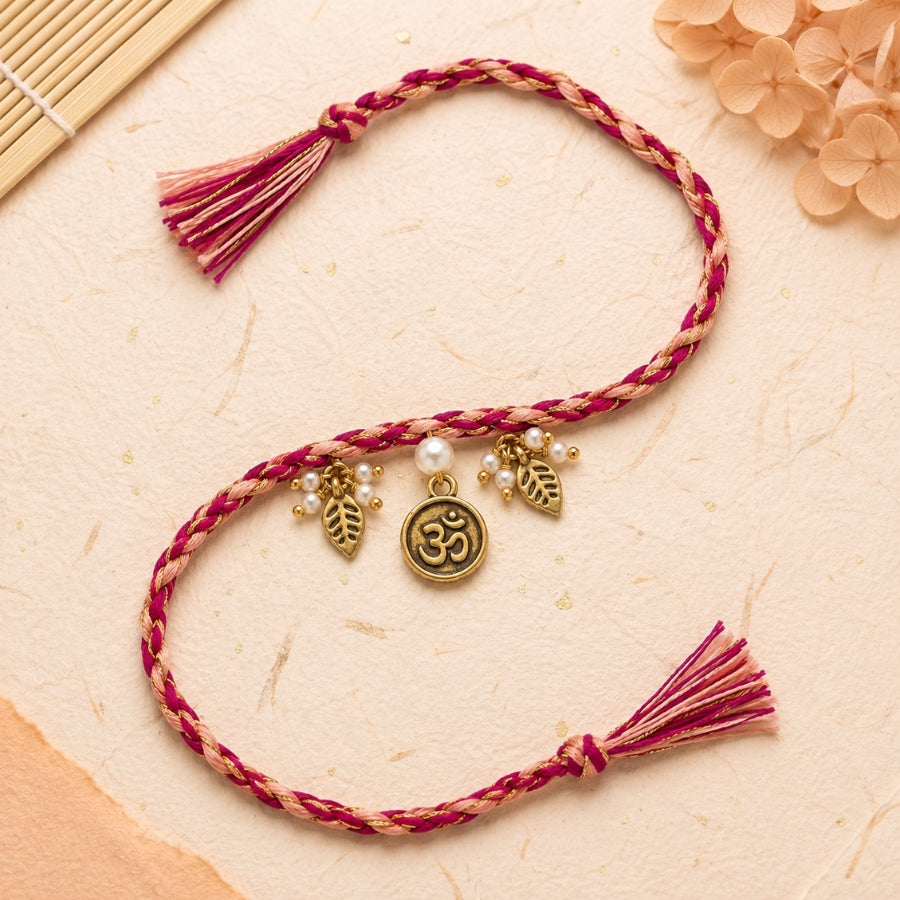 Dual Tone Om Charm Braided Rakhi