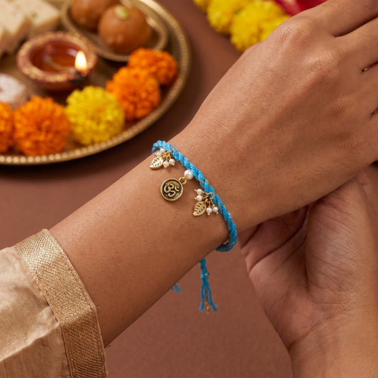 Om Leaf Charm Blue Braided Rakhi