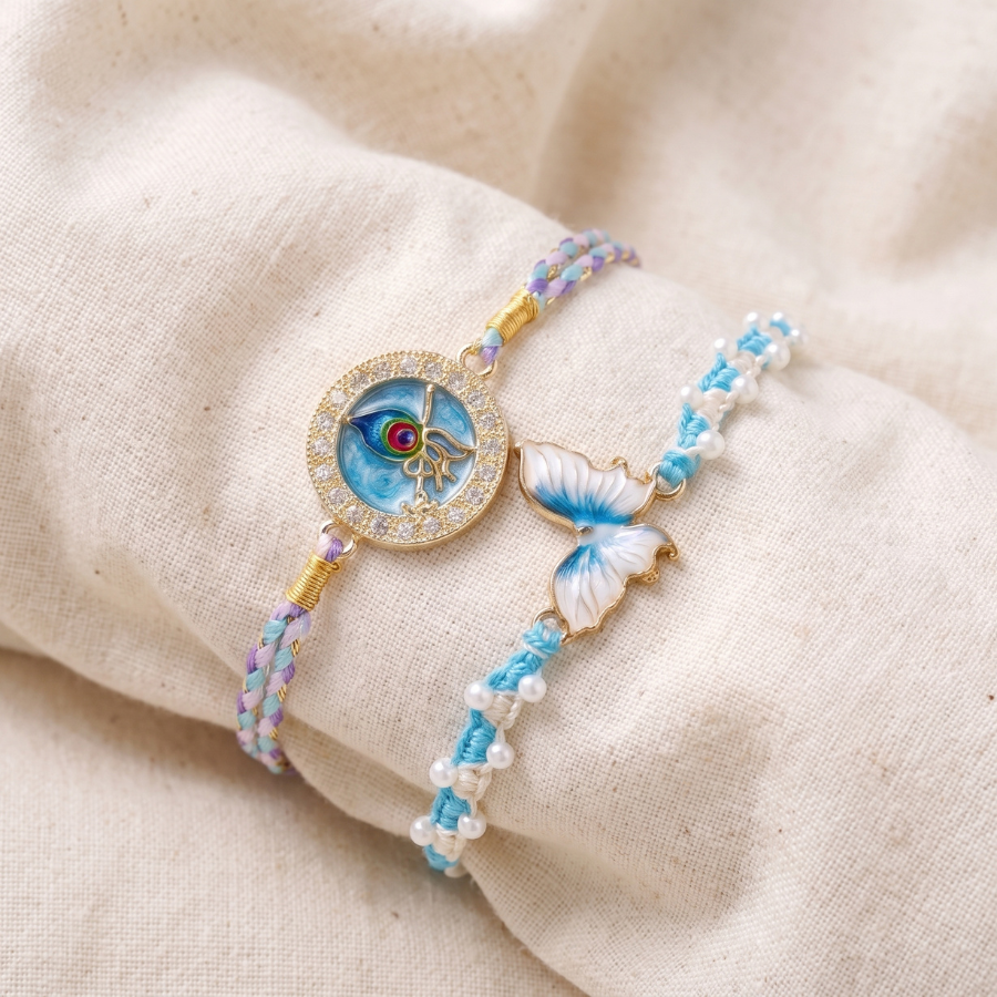 Sky Blue Butterfly Pearl Rakhi & Krishna Mor Pankh Designer Rakhi Set of 2