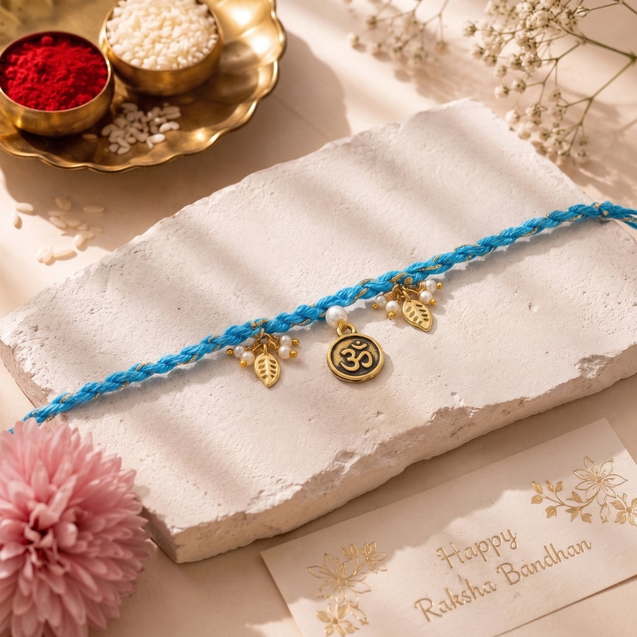 Om Leaf Charm Blue Braided Rakhi