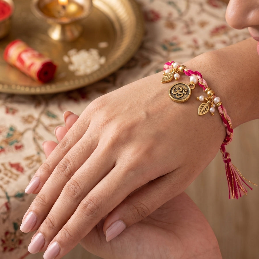 Dual Tone Om Charm Braided Rakhi