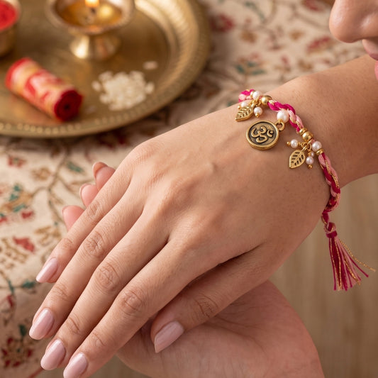 Dual Tone Om Charm Braided Rakhi