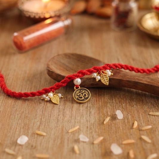Red Om Charm Braided Rakhi